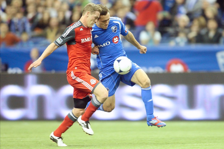 Montreal's Andrew Wenger (R) gets past Toronto FC's Ty Harden in MLS action on Saturday. (Richard Wolowicz/Getty Images) 