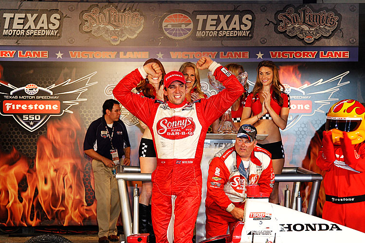 Justin Wilson, driver of the #18 Dale Coyne Sonny's BBQ Dallara Honda, celebrates in Victory Lane after winning the Izod IndyCar Series Firestone 550 at Texas Motor Speedway. (Chris Graythen/Getty Images)