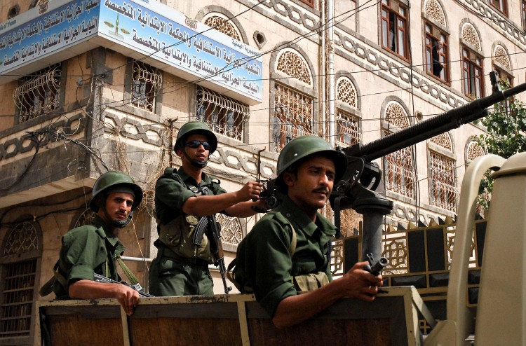 Yemeni soldiers secure the area outside the state-security court in Sanaa during the trial of suspected Al-Qaeda militants on July 13, 2009. The court sentenced six suspected Al-Qaeda militants to death for a spate of deadly attacks on government and Western targets in the impoverished country. (Khaled Fazaa/Getty Images)