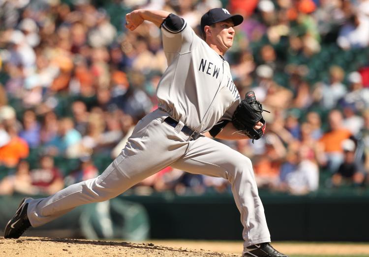 Dustin Moseley dusted himself off after a shaky first inning to capture his first win with the Yankees. (Otto Greule Jr/Getty Images )