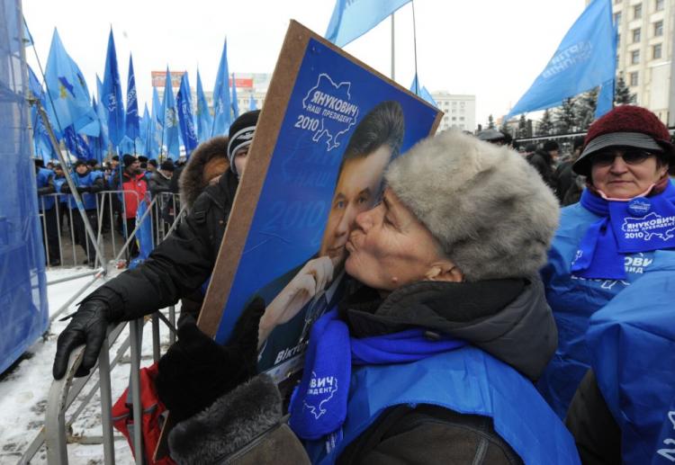A supporter of Ukrainian election winner Viktor Yanukovych kisses his portrait during a rally in front of the Central Election Commission in Kiev on February 10, 2010. (Victor Drachev/AFP/Getty Images)