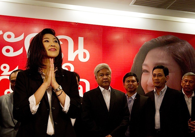 Yingluck Shinawatra greets the media before giving a celebration speech at the Pue Thai party headquarters July 3 in Bangkok, Thailand. (Paula Bronstein/Getty Images)