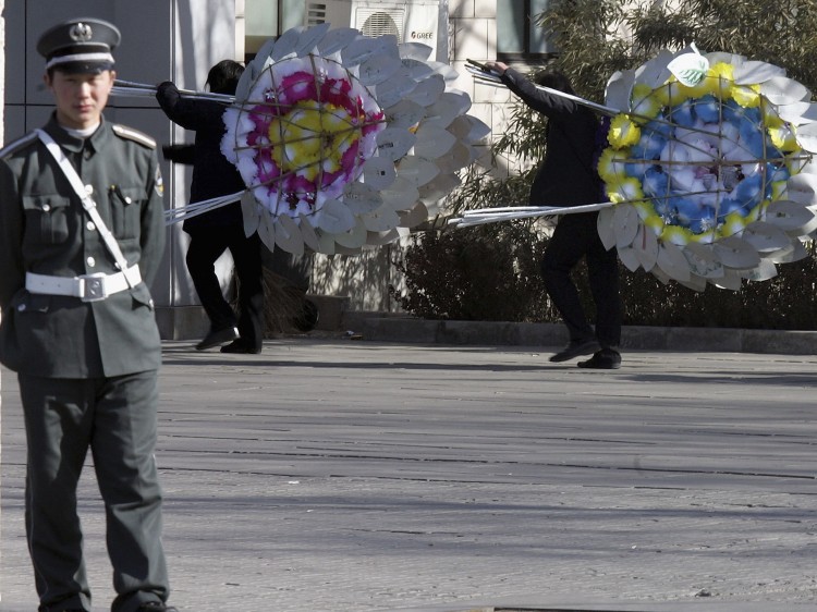 POLITICS OF DEATH: Chinese security guard keeps watch at the end of ceremonies for Zhao Ziyang at his funeral outside the Babaoshan Cemetery on Jan. 29, 2005, in Beijing, China. Leaders' deaths have always been approached with a great deal of sensitivity under the CCP.  (Ng Han Guan/Getty Images)