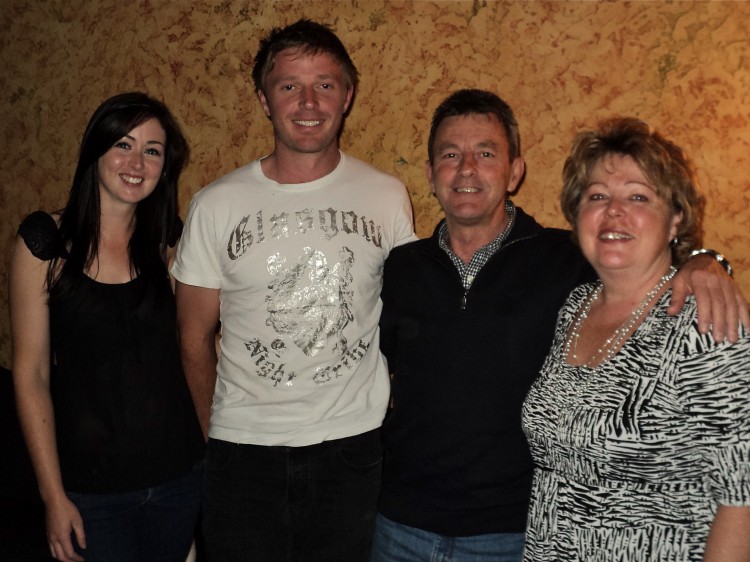 John Adnigde and his wife, Margaret (R), Kylie and Matt attend Shen Yun