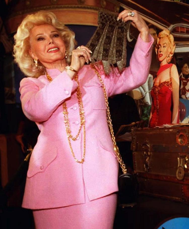 Actress Zsa Zsa Gabor holds up a beaded purse removed from a 30-year-old trunk containing possession's from actress Marilyn Monroe. Zsa Zsa, successfully had her hip replaced, after the actress fell from her bed on Saturday. (Kim Kulish/Getty Images) Actress Zsa Zsa Gabor holds up a beaded purse removed from a 30-year-old trunk containing possession's from actress Marilyn Monroe. Zsa Zsa, successfully had her hip replaced, after the actress fell from her bed on Saturday. (Kim Kulish/Getty Images)