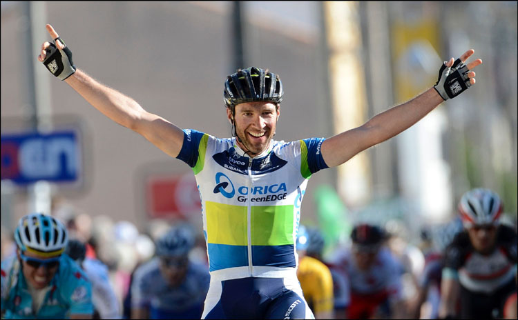 Michael Albisini celebrates as he crosses the finish line to win Stage Four of the Paris-Nice cycling race. (www.greenedgecycling.com/) 