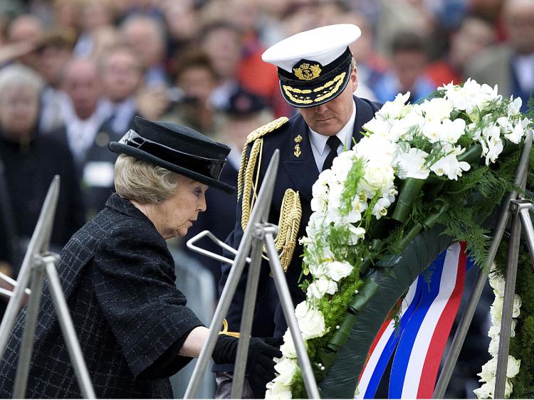 Dutch Queen Beatrix and Prince Willem-Alexander lay a garland at the National Monument on May 4, 2009 at the Dam Square in Amsterdam, The Netherlands, to commemorate all the Dutch casualties of war since the Second World War.  (Robin Utrecht/AFP/Getty Images)