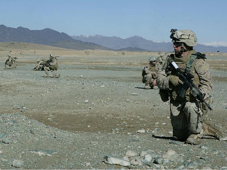 ON PATROL: 2nd Lt. John Langer, a platoon commander with Company L, 3rd Battalion, 8th Marine Regiment, walks down an alley in Helmand province, Afghanistan.  (Cpl. Pete Thibodeau/DVIDS)