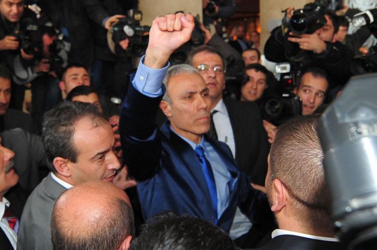 Turk Mehmet Ali Agca (C), 52, who attempted to kill Pope John Paul II on May 13, 1981, clenches his fist on Jan. 18, 2010, in Ankara after being freed from prison after almost three decades behind bars. (Mustafa Ozer/AFP/Getty Images )