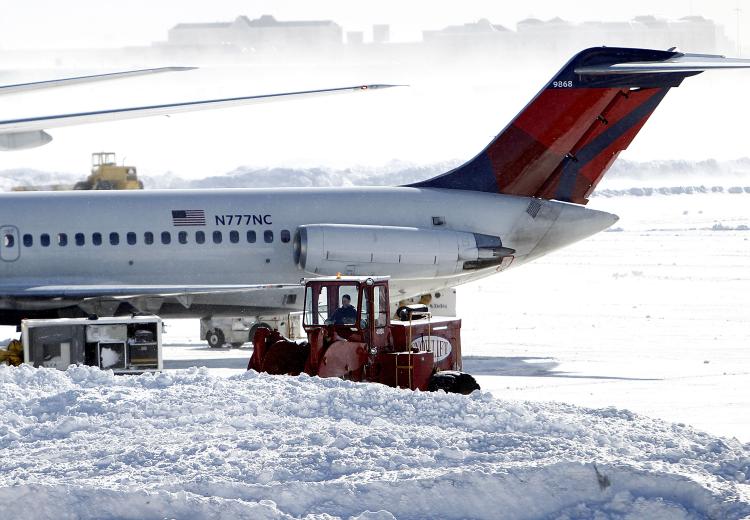 Snow removal equipment operates at Newark Liberty International Airport Terminal B following a major blizzard on December 27, 2010 in Newark, New Jersey. (Jeff Zelevansky/Getty Images)