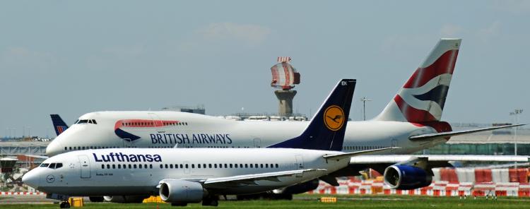 GROUNDED: A Lufthansa and British Airways passenger jets taxi onto the runway before taking off from London Heathrow Airport on May 24. The European airlines may struggle after losing millions in revenues due to volcanic ash. (Adrian Dennis/Getty Images)