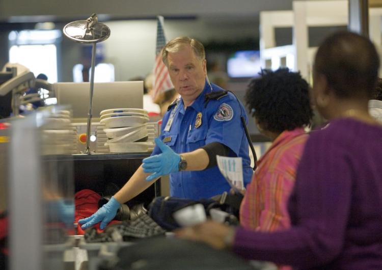 TSA officer screens airline passengers in Terminal C at Dallas/Fort Worth International Airport Dec 27 in Dallas, Texas. Pre-flight screenings were stepped up after Umar Farouk Abdulmutallab, 23, of Nigeria allegedly tried to blow up a Northwest Airlines  (Tom Pennington/Getty Images)