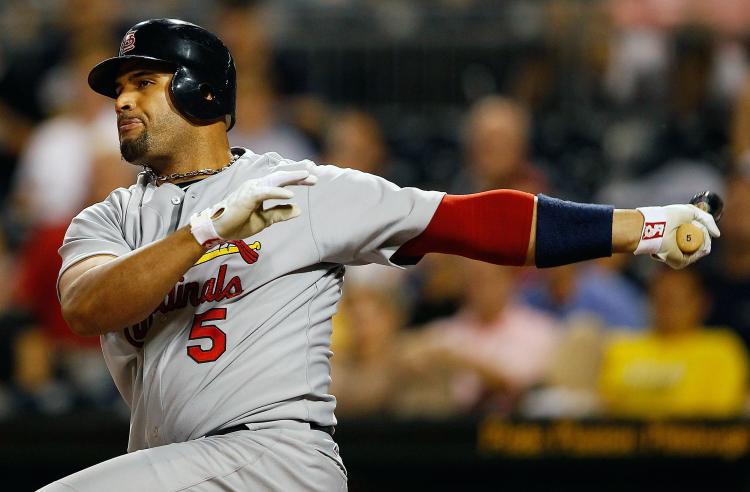 Albert Pujols #5 of the St. Louis Cardinals hits an RBI single against the Pittsburgh Pirates during the game on September 21, 2010 at PNC Park in Pittsburgh, Pennsylvania. (Jared Wickerham/Getty Images)