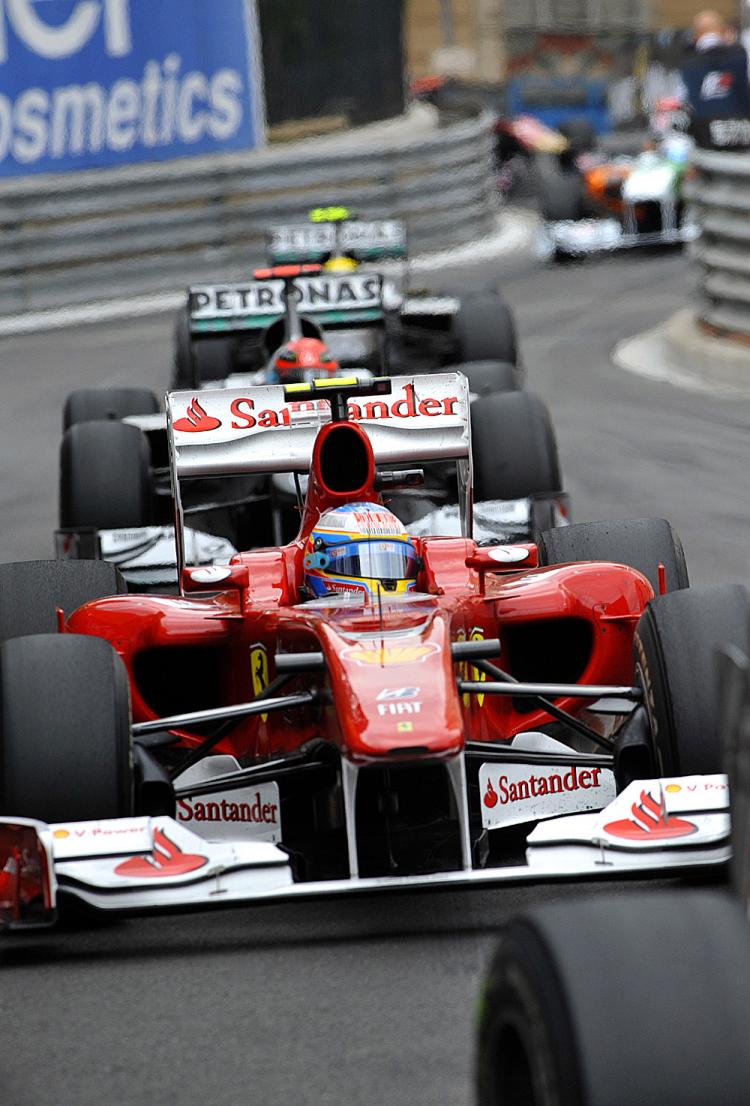 Fernando Alonso leads Michael Schumacher at the Formula One Monaco Grand Prix. (Gerard Julien/AFP/Getty Images)