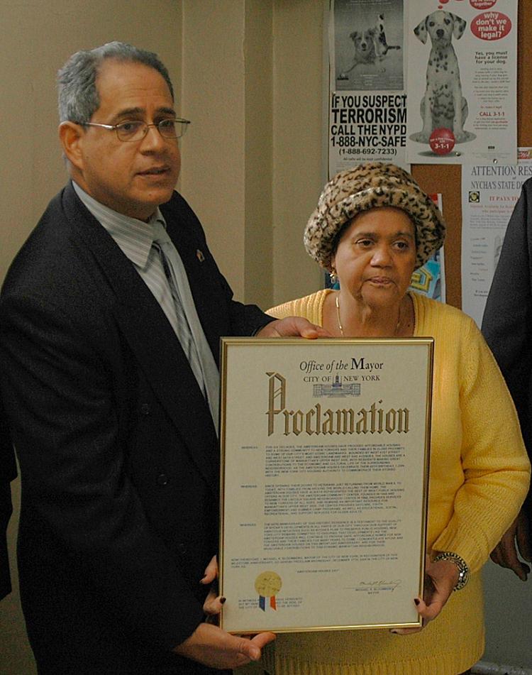 ACKNOWLEDGEMENT: Amsterdam Houses president Margarita Curet gets recognized for her work with the low-income projects. (Jonathan Weeks/The Epoch Times)