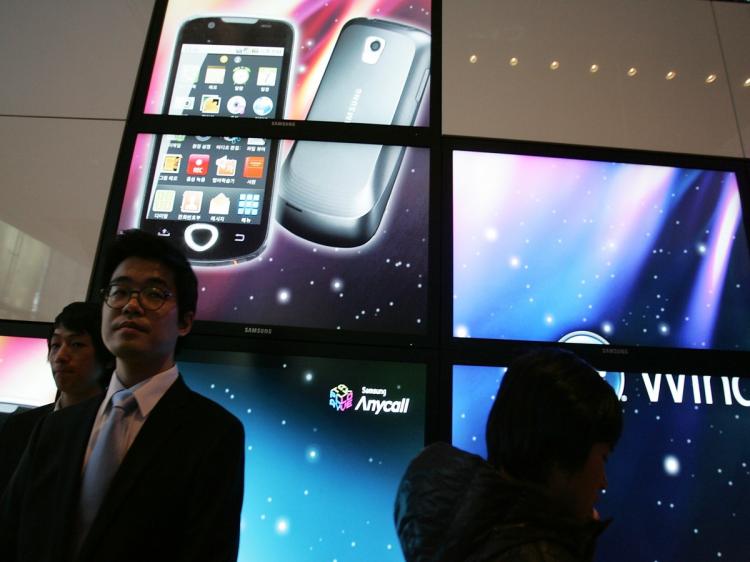 Visitors attend Samsung Electronics Co's Android smartphones during the unveiling ceremony on Feb 4, 2010 in South Korea. Google is reportedly planning a launch of a Google TV platform, partnering with Intel, Sony and Logitech. (Chung Sung-Jun/Getty Images)