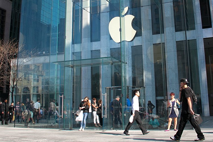 People shop at Apple's Flagship store on Fifth Avenue in New York