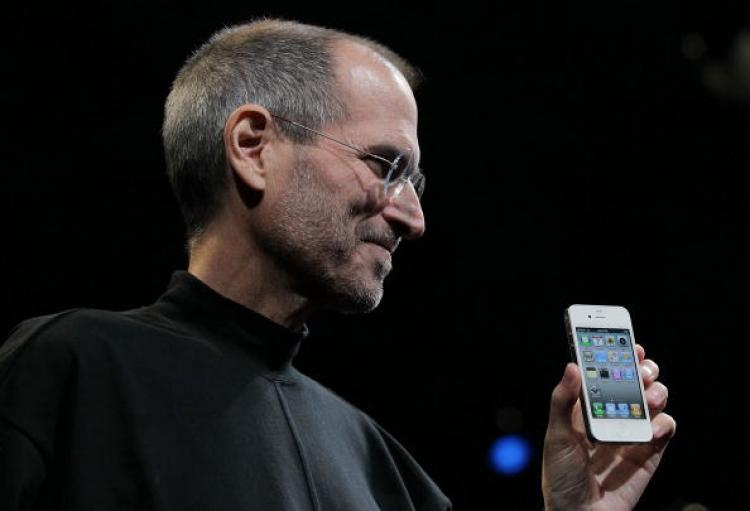 Apple CEO Steve Jobs holds the new iPhone 4, with integrated gyroscope, after he delivered the opening keynote address at the 2010 Apple World Wide Developers conference June 7, in San Francisco. (Justin Sullivan/Getty Images)