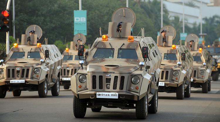 Mumbai policemen ride in armored vehicles during a parade to commemorate the second anniversary of the November 2008 terror attacks in Mumbai on Nov. 26. (Punit Paranjpe/AFP/Getty Images)