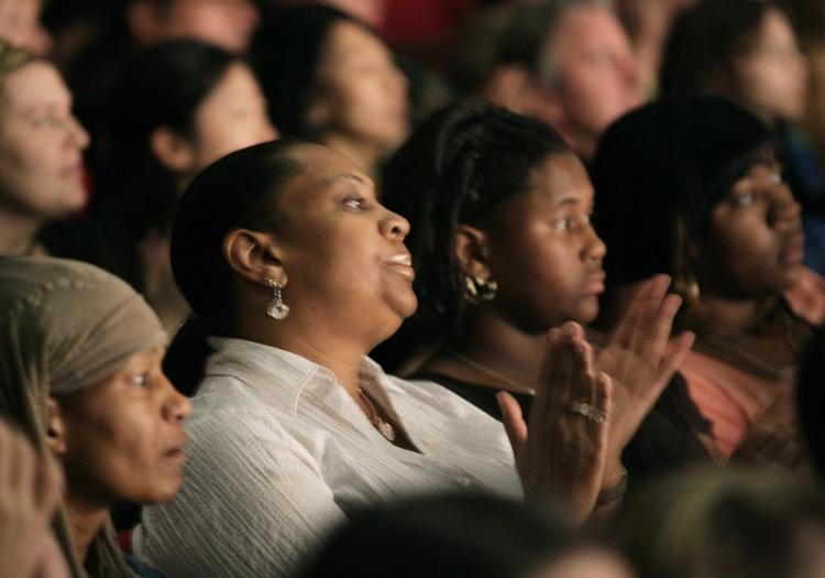 Audience members applaud during the DPA performance on Dec. 19 in Atlanta. (The Epoch Times)