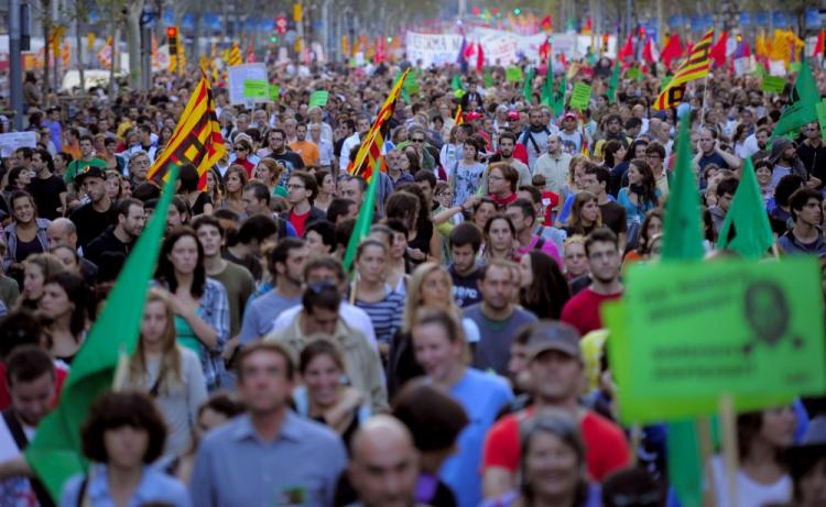 Austerity Protests: Demonstrators walk with flags, placards and banners in central Barcelona during the general strike held in Spain on September 29, 2010. (Josep Lago/AFP/Getty Images)