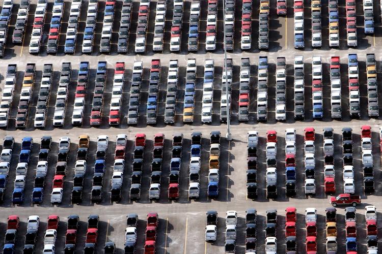 Numerous 2009 Ford F-150 trucks are parked in a lot before being shipped on November 21, 2008 in Detroit, Michigan. (Spencer Platt/Getty Images)