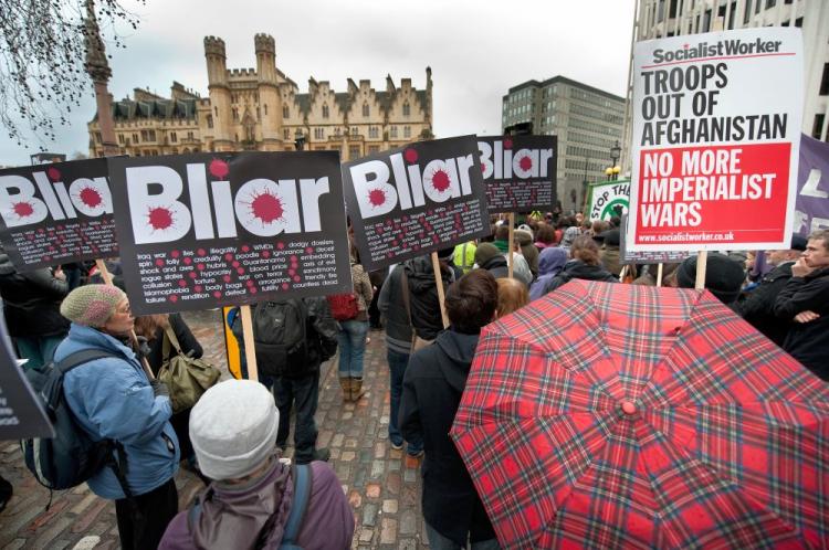 Protesters in front of the Queen Elizabeth Conference Center on Jan. 29, in London, England. Tony Blair, Britain's prime minister from May 1997 to June 2007, faced questions on the invasion of Iraq from Chairman of the Inquiry Sir John Chilcot. This is the United Kingdom's fourth inquiry into the Iraq war. When asked if he had any regrets, Mr. Blair responded, 'No.' (Marco Secchi/Getty Images )