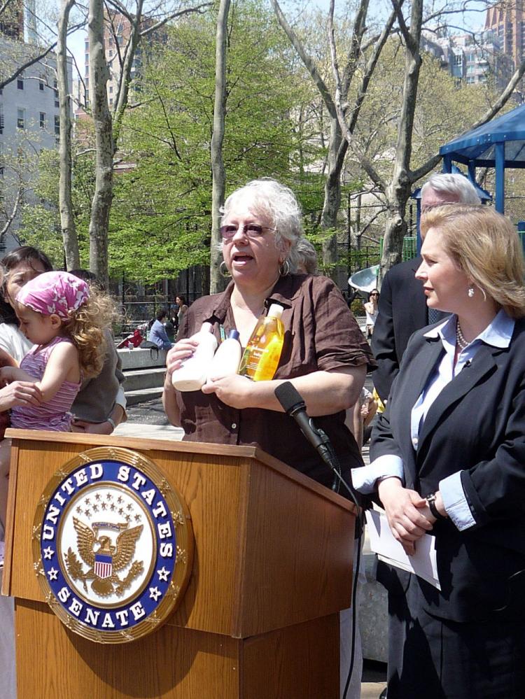 Marian Feinberg of For a Better Bronx holds up baby products that tested positive for toxins as U.S. Senator Kirsten Gillibrand looks on. (Christine Lin/The Epoch Times)