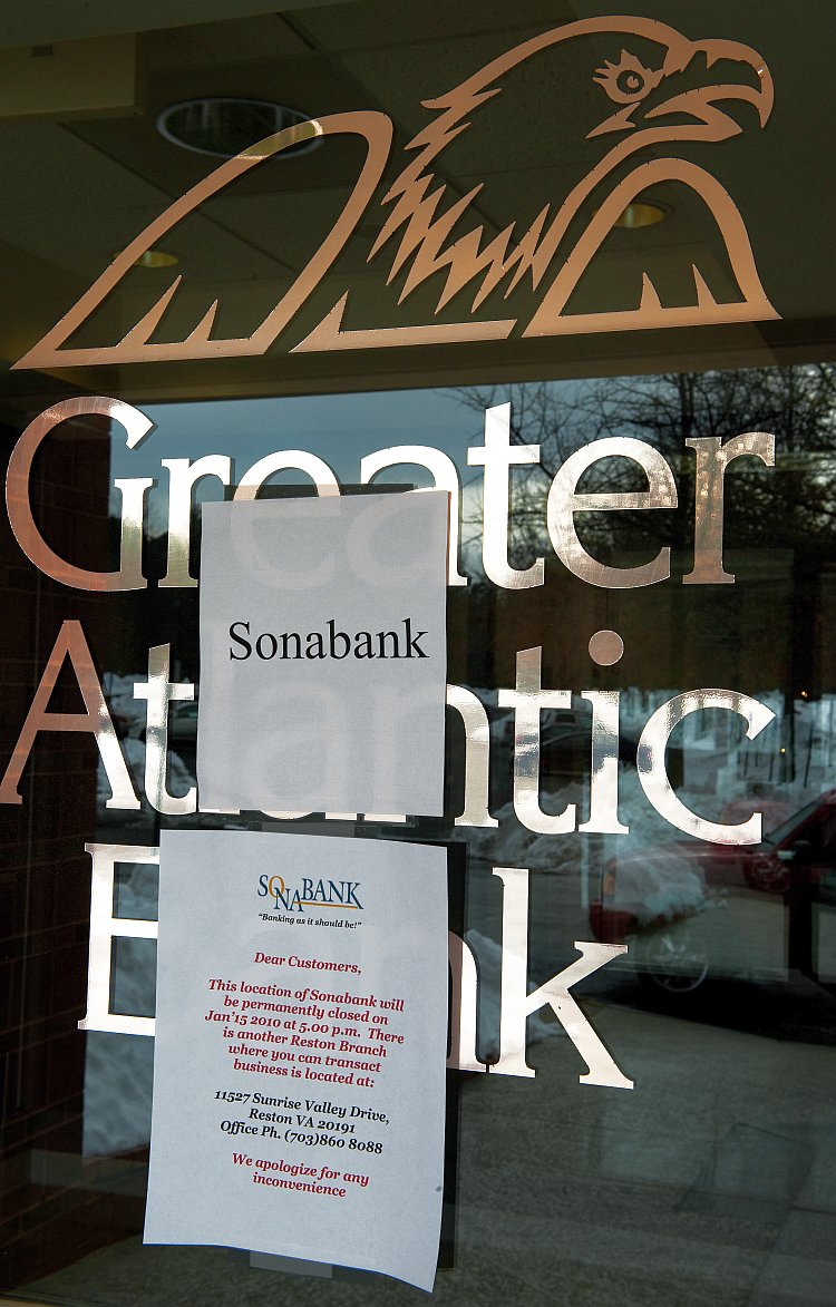 This file photo shows the door to the Greater Atlantic Bank, Reston, Va.
