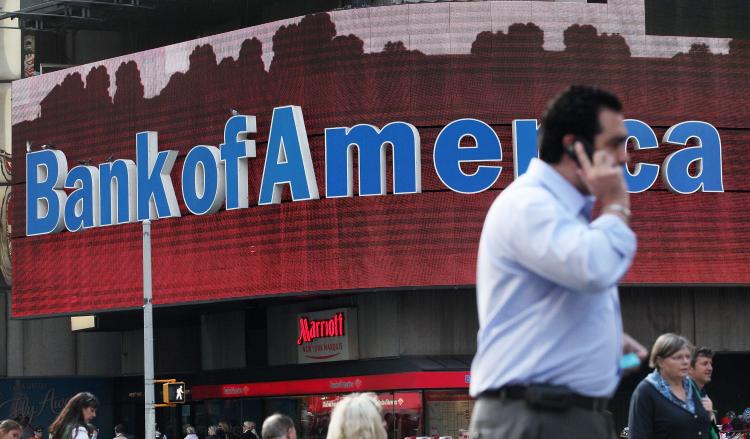 Bank of America, short on cash and rushing to pay back a TARP loan, may have to pay employee bonuses in stock, reports said over the weekend. (Mario Tama/Getty Images)