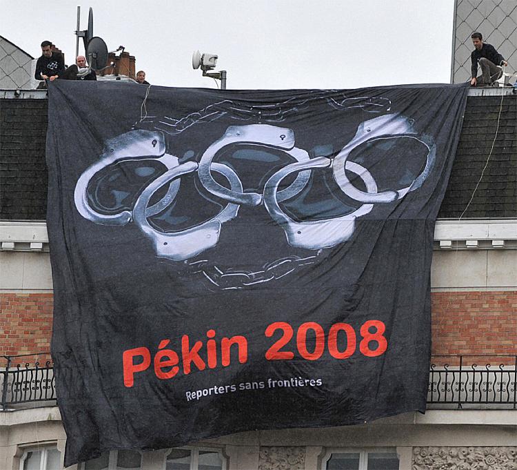 Reporters Without Borders, Paris-based international non-governmental organization that advocates freedom of the press, display a banner calling for boycott of the 2008 Olympic Games in Beijing during a European Summit in front of the headquarters of the  (Dominique Faget/AFP/Getty Images)