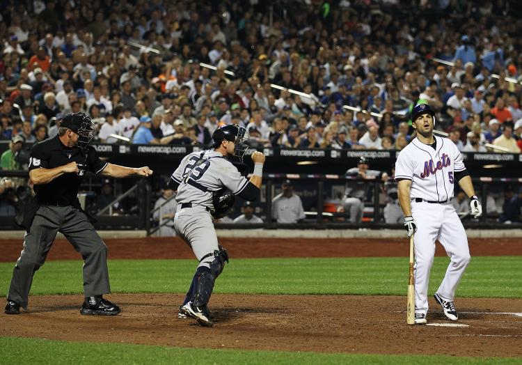 CAUGHT LOOKING: Umpire Jim Wolf calls 'Strike 3' on David Wright. A machine calling balls and strikes cannot replace this drama.