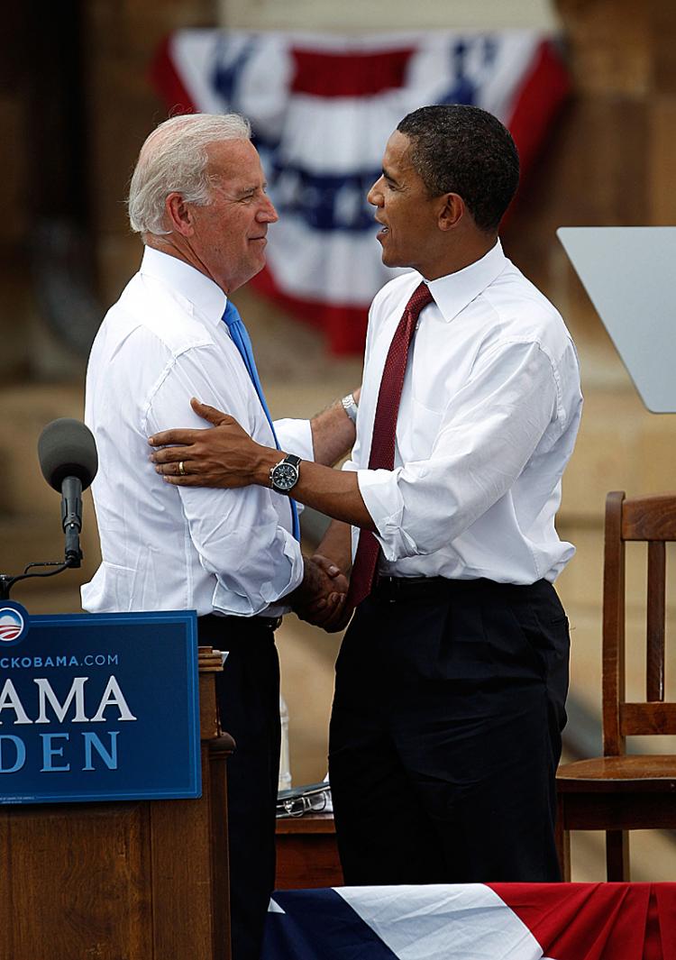 Democratic presidential candidate Senator Barack Obama (R) greets Senator Joe Biden during a rally on the lawn of the Old State Capital August 23, 2008 in Springfield, Illinois. (Scott Olson/Getty Images)