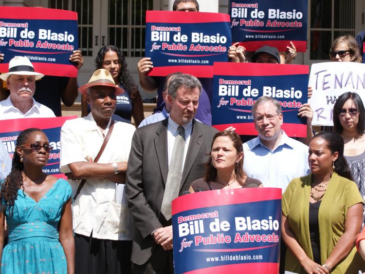 Public advocate candidate Bill de Blasio (center-left) introduces his new Slumlord Watch List this Sunday in front of City Hall.  (Diana Hubert/Epoch Times Staff)