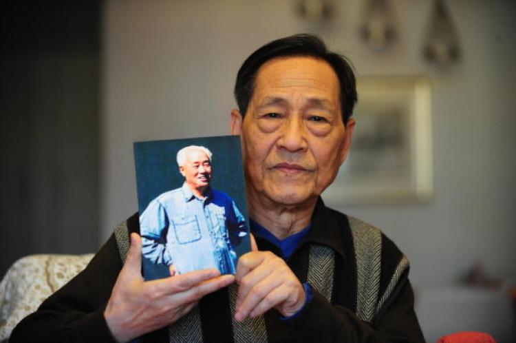 Bao Tong holds up a photo of Zhao in his home in Beijing. (Frederic J. Brown/AFP/Getty Images)