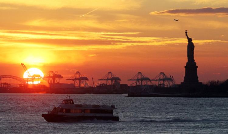NEW YORK HARBOR: A view of the Statue of Liberty and New York Harbor at sunset last month. (Mario Tama/Getty Images) NEW YORK HARBOR: A view of the Statue of Liberty and New York Harbor at sunset last month. (Mario Tama/Getty Images)
