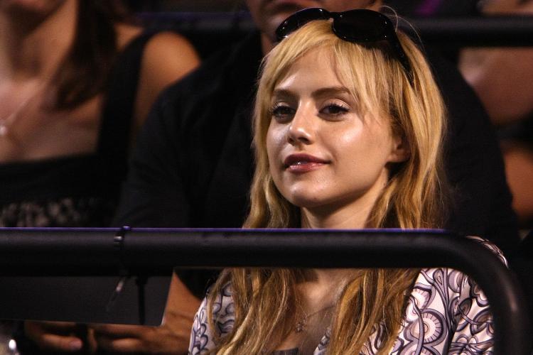 In this file photo, actress Britney Murphy watches a tennis game Apr. 3 in Florida. The actress' funeral was held in Los Angeles on Christmas Eve. (Chris McGrath/Getty Images)