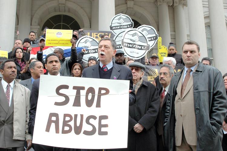 Nelson Eusebio speaks on the steps of City Hall Thursday about the ill effects on small businesses of a proposed bottle bill expansion. (Jonathan Weeks/Epoch Times)