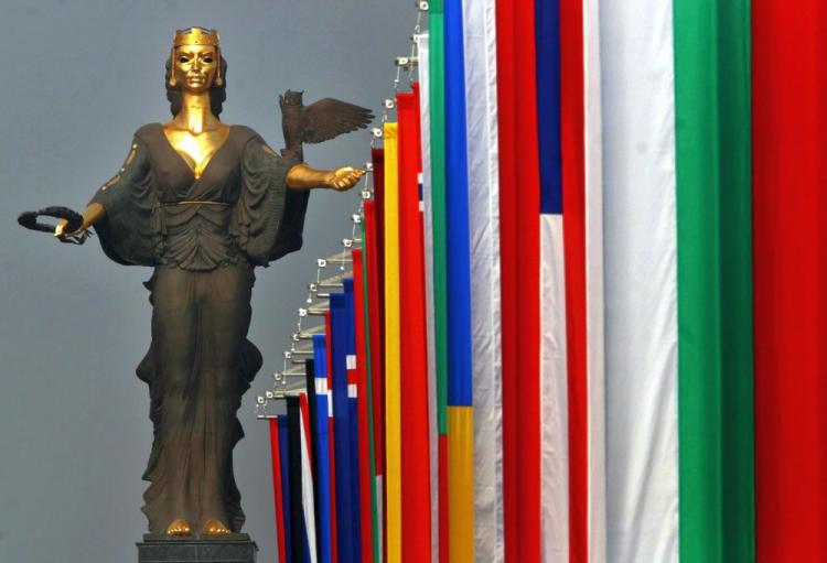 The flags of NATO member countries are raised in front of the statue of Saint Sofia in central Sofia, April 2, 2004. The U.S. plans to erect a missile defense shield in Eastern Europe to intercept missile attacks from Iran an Korea. Russia opposes the plan accusing the U.S. directing the sheild against it. (Dimitar Dilkoff/AFP/Getty Images)