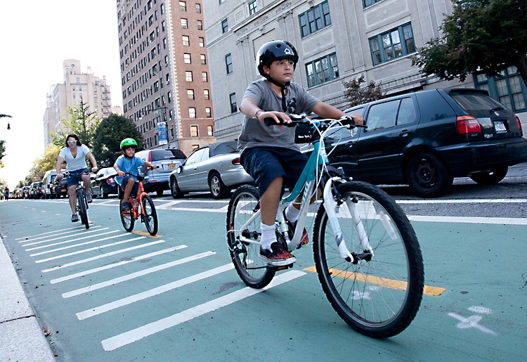 Cyclists ride near Grand Army Plaza in Brooklyn. (Amal Chen/The Epoch Times)