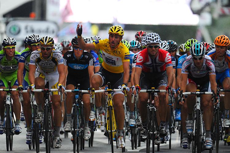 Fabian Cancellara (C) asks the riders not to sprint to support the riders who crashed during Stage Two of the 2010 Tour de France. (Pascal Pavani/AFP/Getty Images)