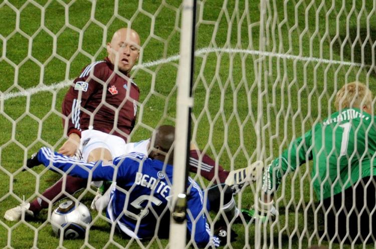 Colorado striker Conor Casey jabs home the first goal for the Rapids. (Harry How/Getty Images)