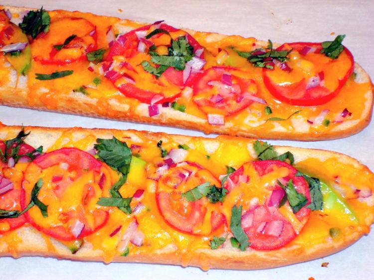 A crusty baguette loaded with cheese, tomatoes, onions, avocado and cilantro. (Sandra Shields/The Epoch Times)