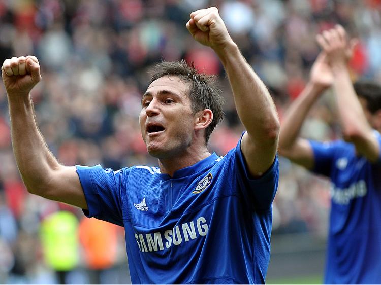 SUPER FRANK: Frank Lampard celebrates after getting the second goal, knowing Chelsea has one hand on the title. (Paul Ellis/AFP/Getty Images)