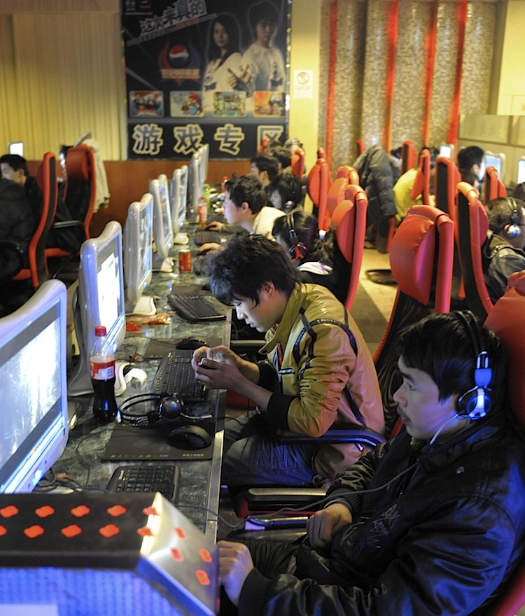 Chinese netizens play online games at an internet cafe in Beijing