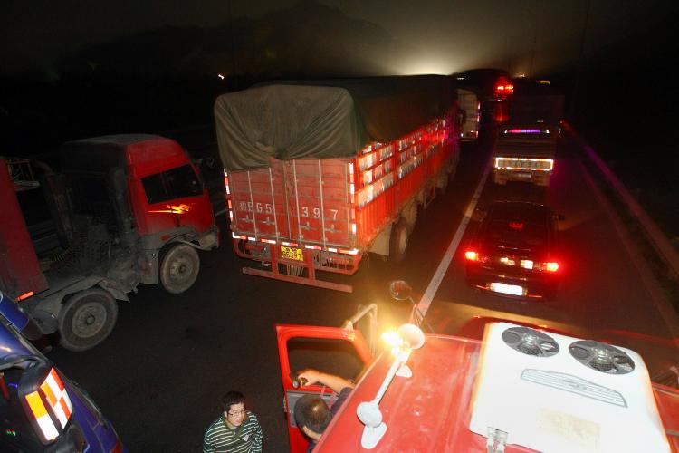 China's traffic jam has lasted for ten days, stretching 60 miles back. In the photo, truckers wait in their vehicles on the highway leading towards Beijing in Guo Lei Zhuang, in northern China's Hebei province on August 23, 2010. (STR/AFP/Getty Images)