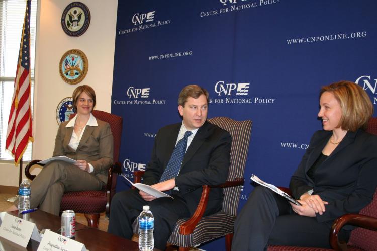 Jacqueline Newmyer (r), president and CEO of Long Term Strategy Group, and Kristen Gunness (l), advisor to the U.S. Department of the Navy, discuss the implications of today's economic downturn on China's military plans, while Scott Bates (center), vice-p (Gary Feuerberg/The Epoch Times)