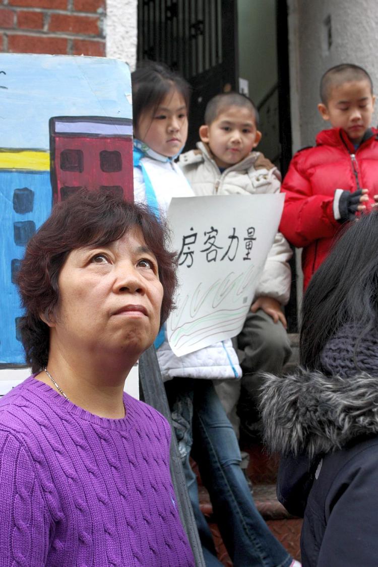 Tony Tsai, of the Coalition to Protect Chinatown, riles up a crowd infront of East Bank in protest of rezoning of the area. (Cliff Jia/The Epoch Times)