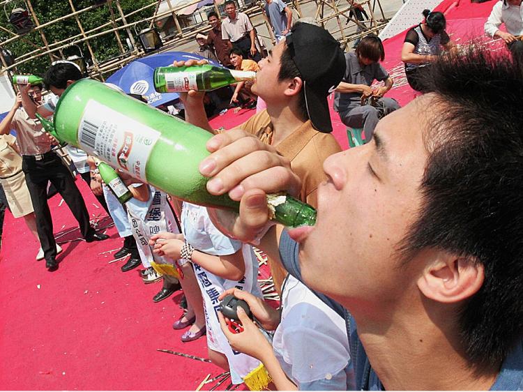 Chinese youth takes part in a beer drinking competition in Nanjing of Guangxi Autonomous Region, China.   (China Photos/Getty Images)