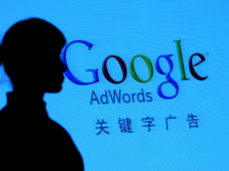 'We are watching you, Google.' The CCP used faked evidence to cow Google into helping the Chinese regime oppress its citizens. (China Photos/Getty Images)